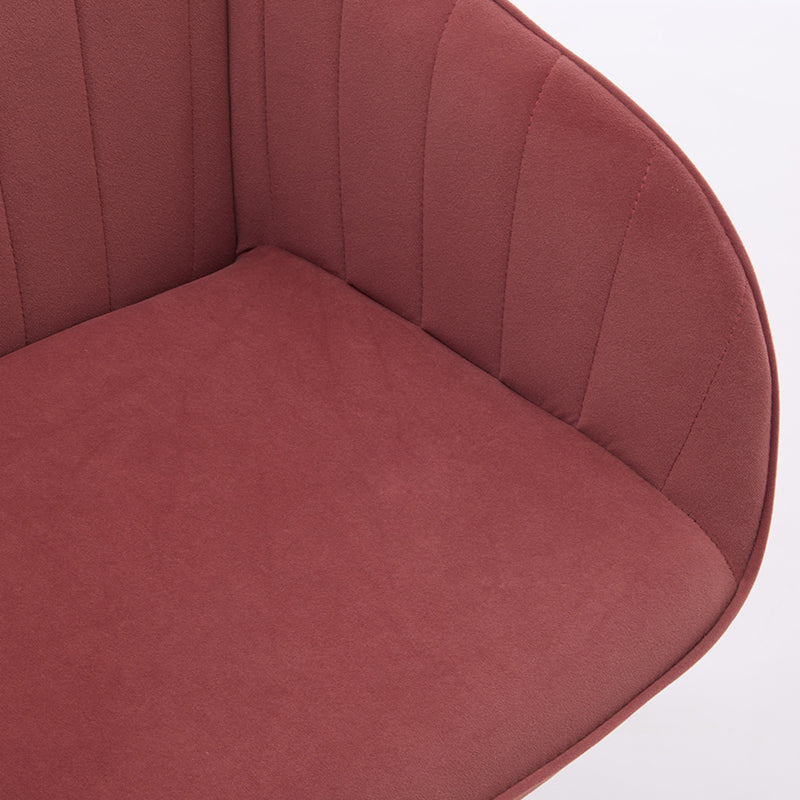 Closeup of plush rose velvet accent chair seat and fluted back