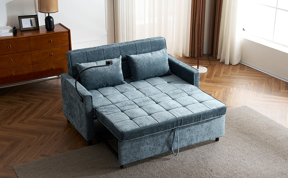 Blue fabric sofa bed with pullout mattress and quilted cushions