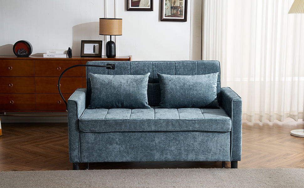 Blue velvet sleeper sofa with quilted cushions and two throw pillows