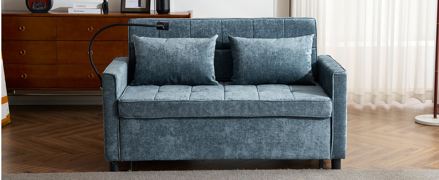 Teal velvet sofa bed with two accent pillows
