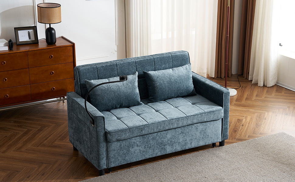 Teal blue tufted sofa bed with two accent pillows