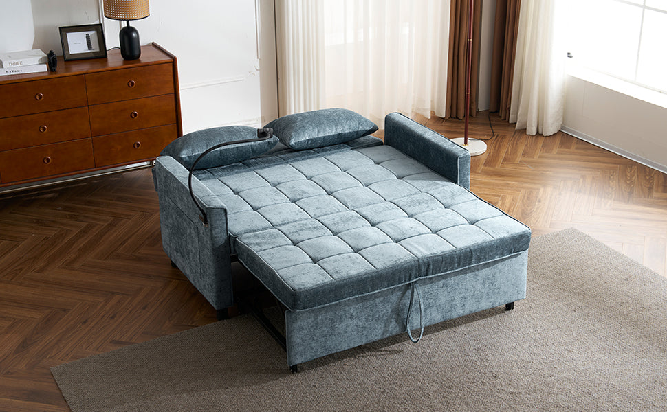 Tufted teal velvet sleeper sofa in partially extended bed mode