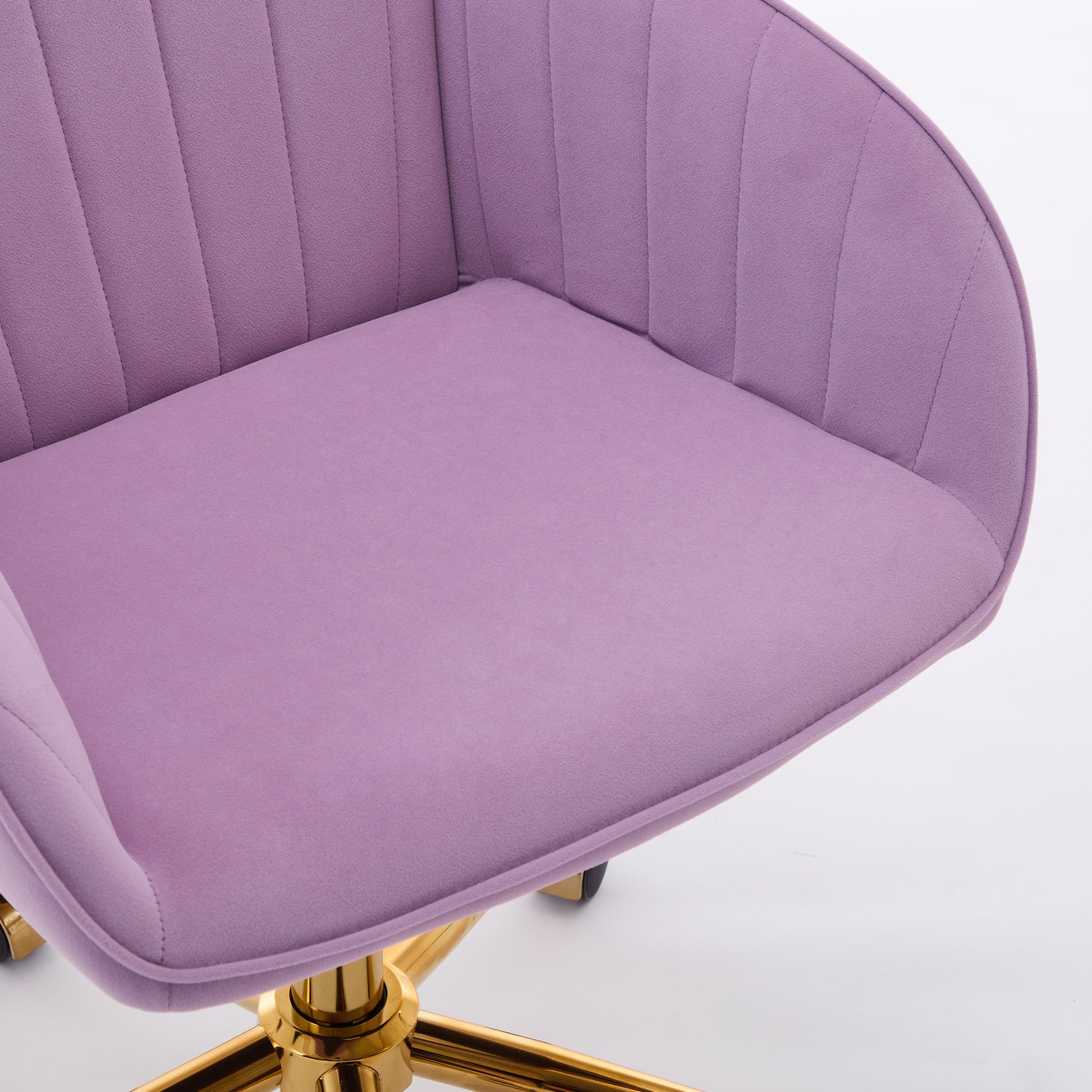 Purple velvet accent chair with tufted back and gold legs