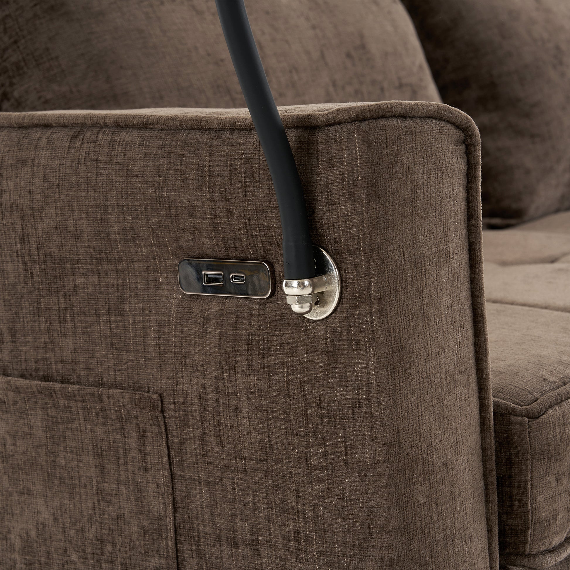 Brown fabric recliner armrest with integrated USB charging ports
