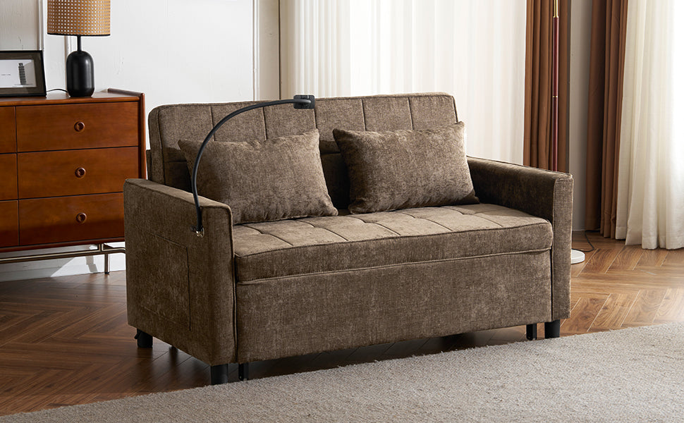 Brown upholstered sofa bed with two throw pillows and attached reading lamp