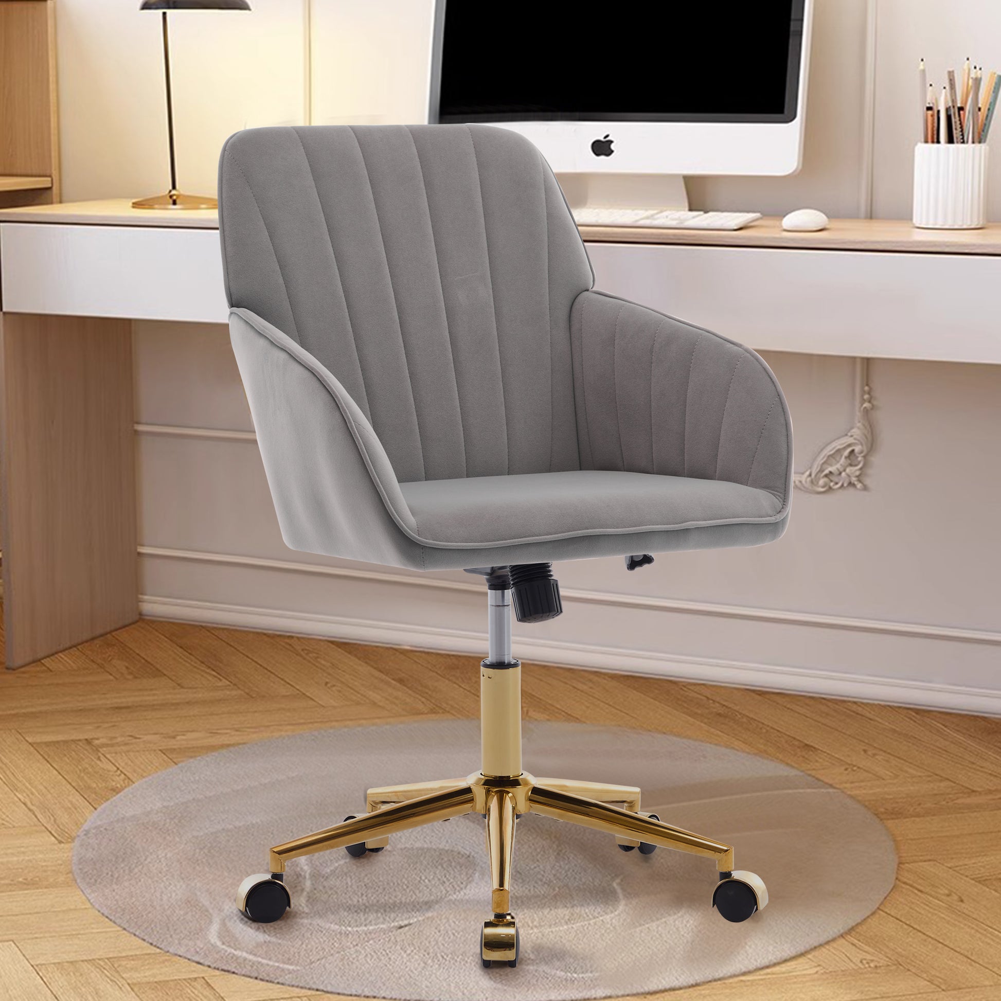 Grey velvet office chair with plush tufting and gold accents