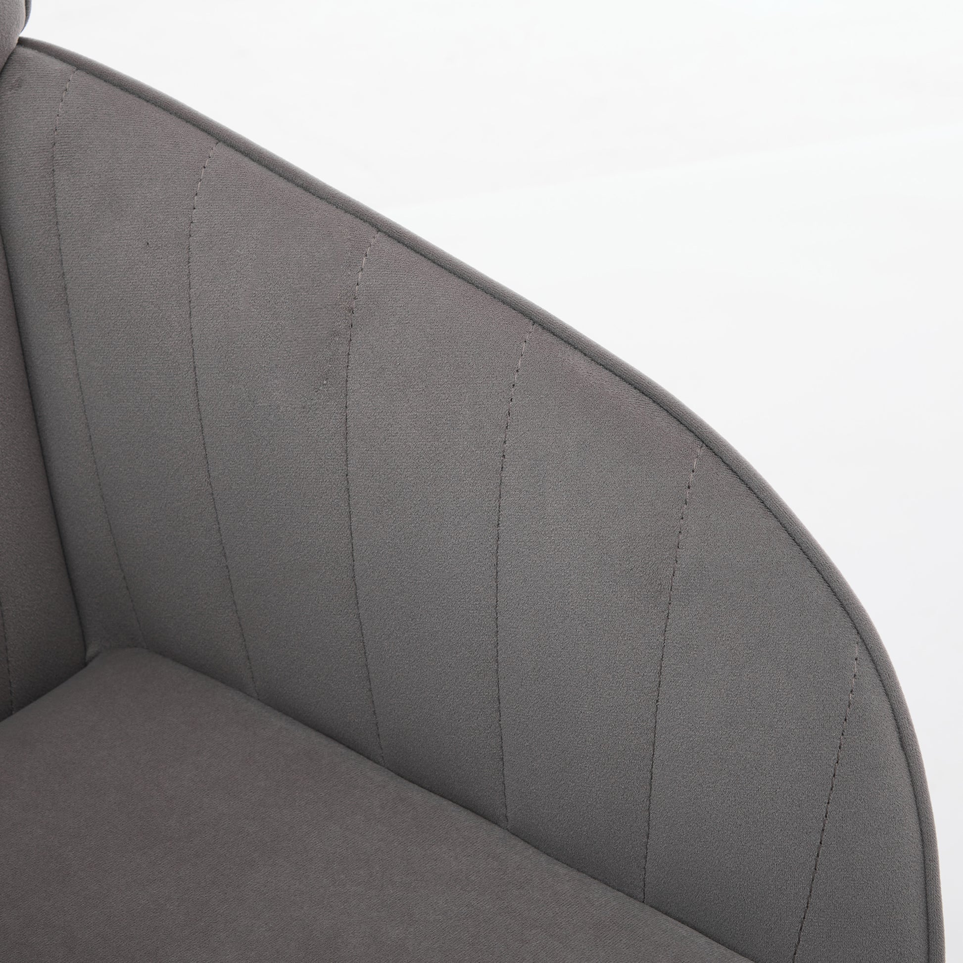 Closeup of upholstered grey modern chair with vertical stitching detail