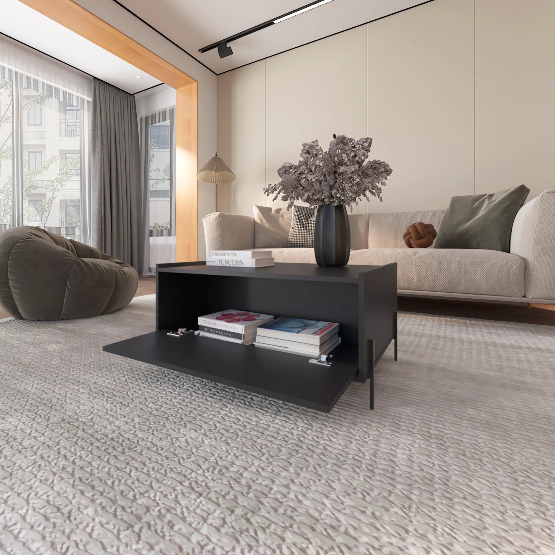 Modern black storage coffee table with open compartment and books
