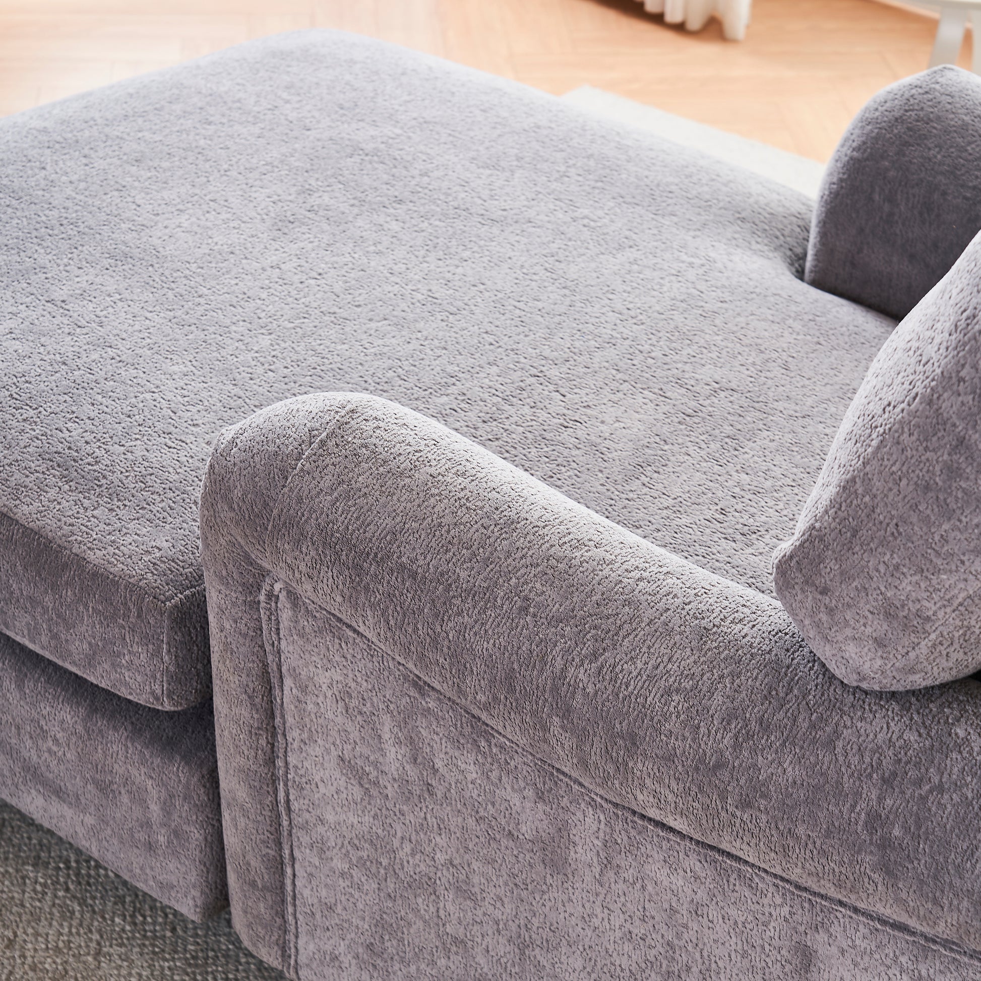 Plush grey velvet sectional sofa with chaise