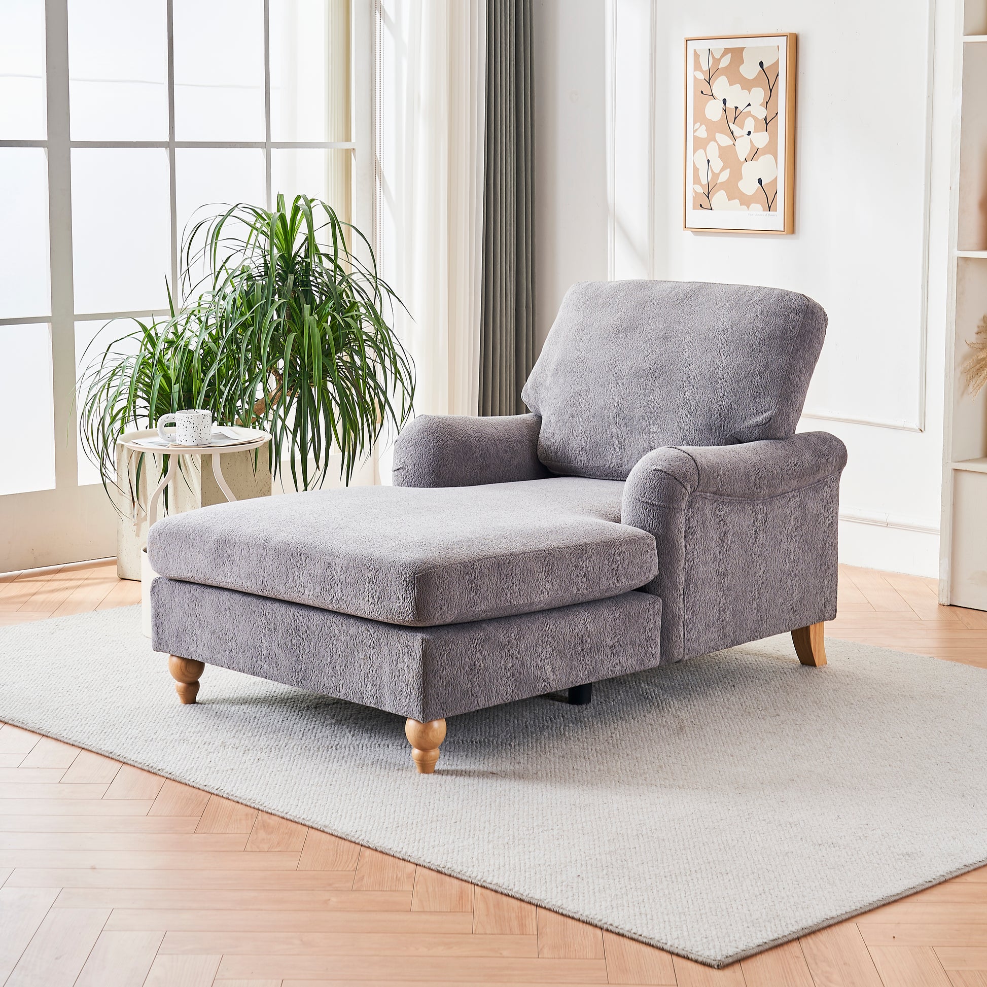 Gray fabric chaise lounge with rolled arms and wooden feet