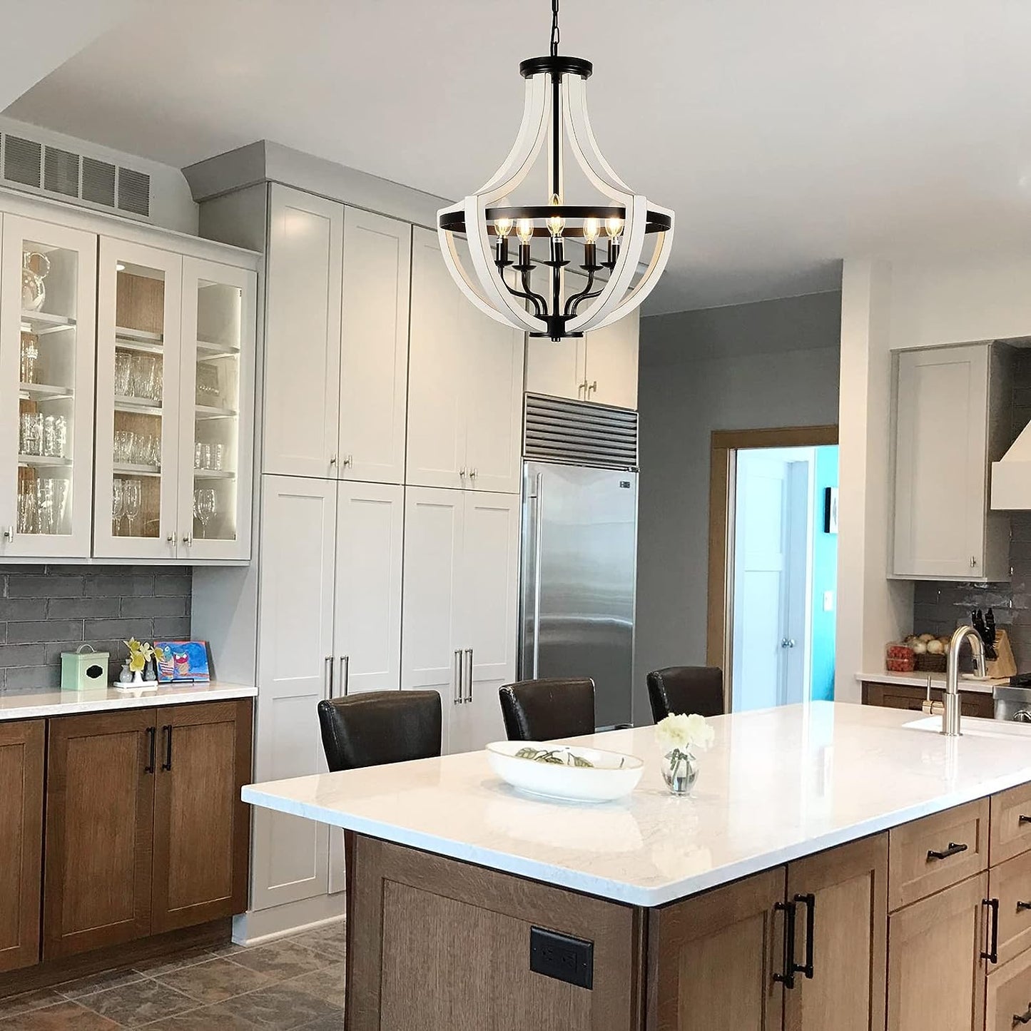 Farmhouse chandelier with white wood accents and black metal frame