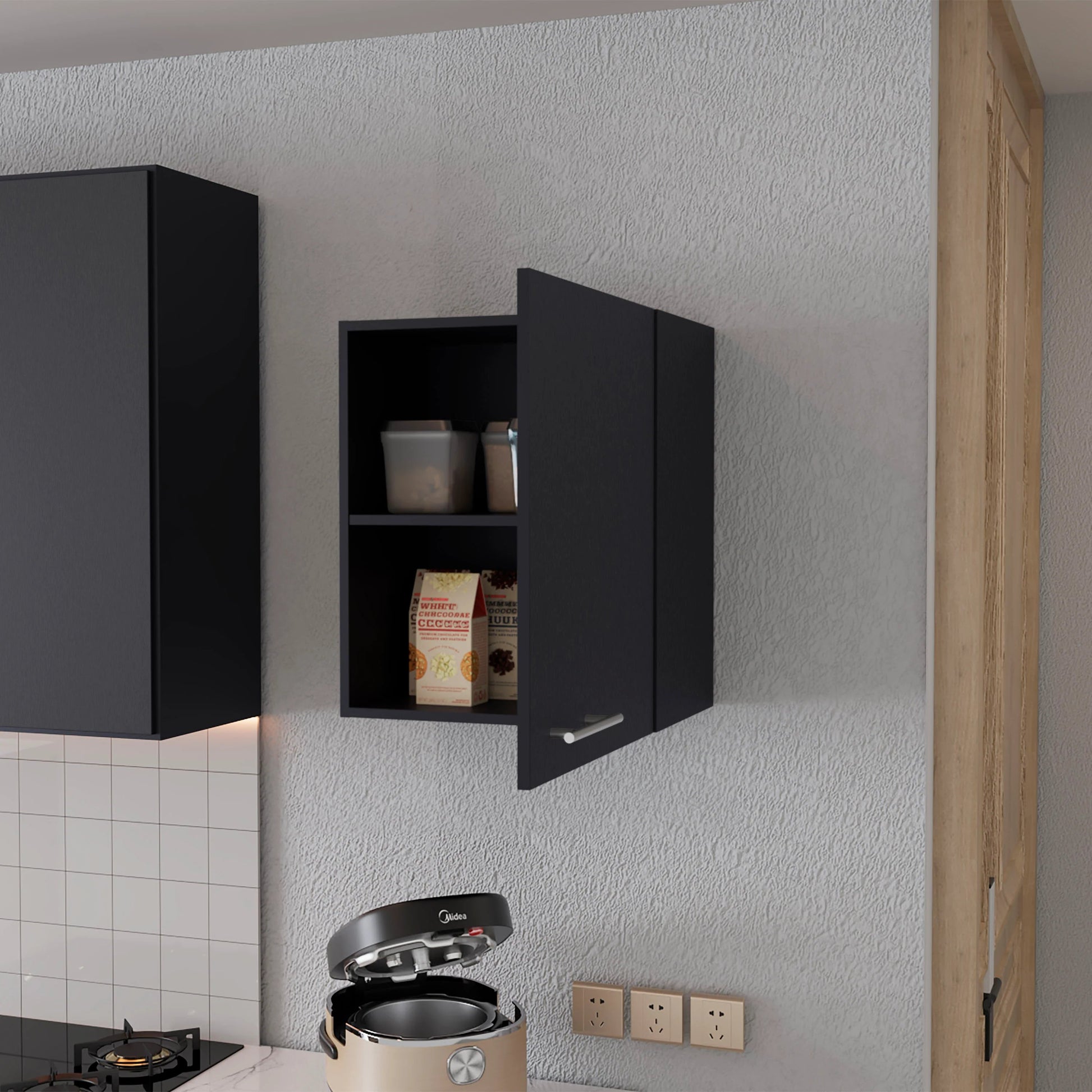 Black modern kitchen cabinet with stainless steel handle and open door revealing pantry items