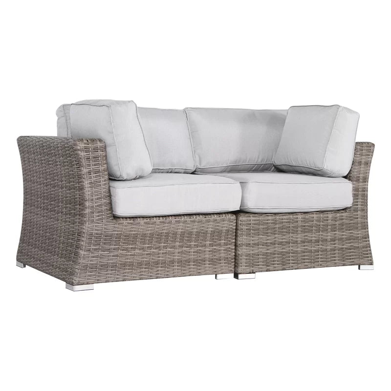 Gray wicker sectional sofa with light gray cushions