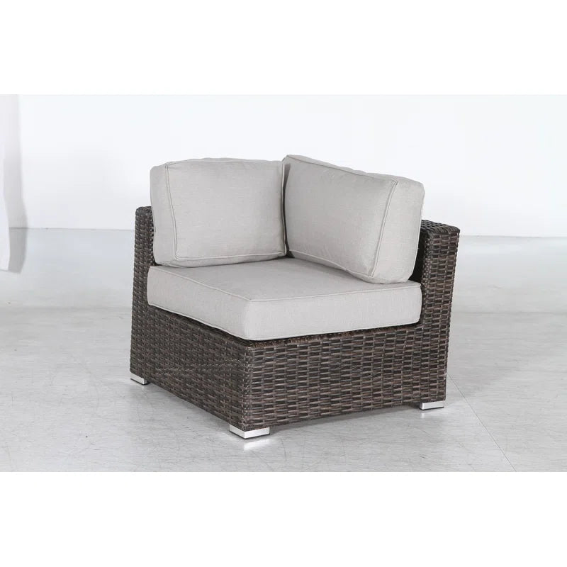 Brown wicker outdoor sectional corner chair with light gray cushions