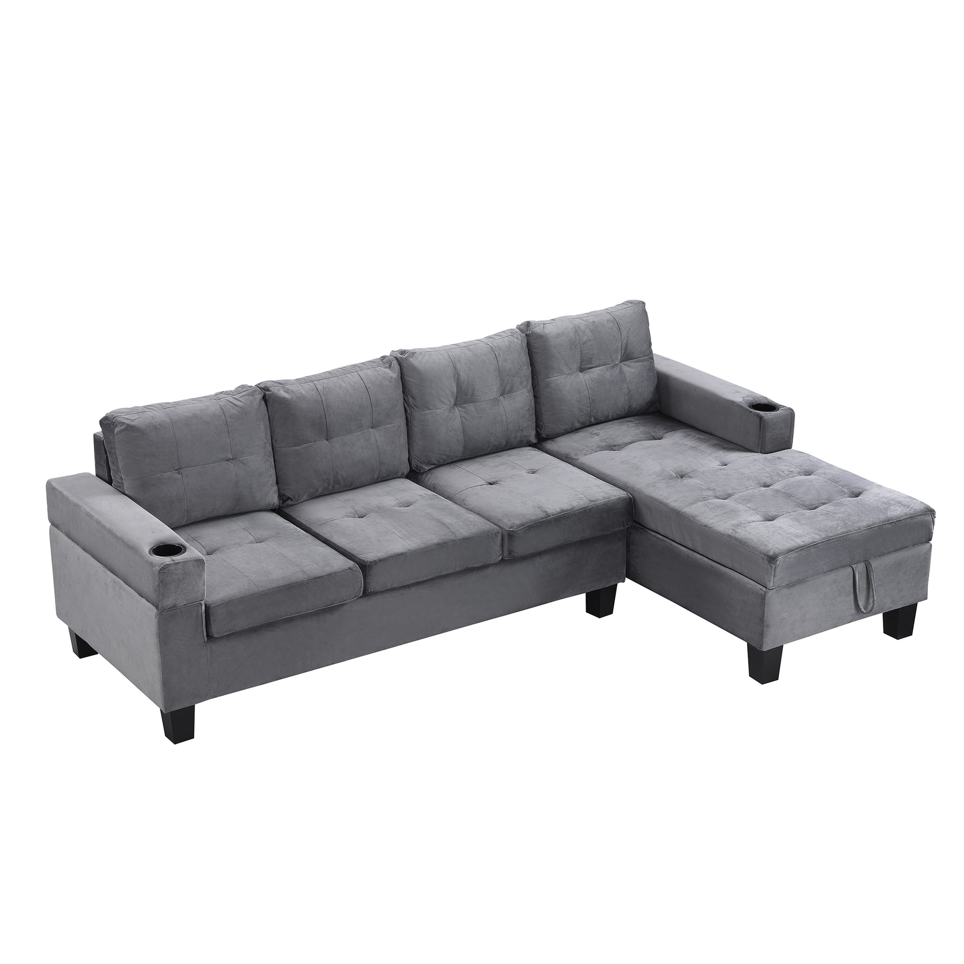 Grey velvet sectional sofa with tufted cushions and builtin cup holders