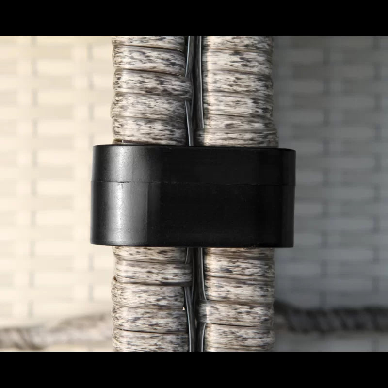 Black hose clamp secures braided grey garden hose