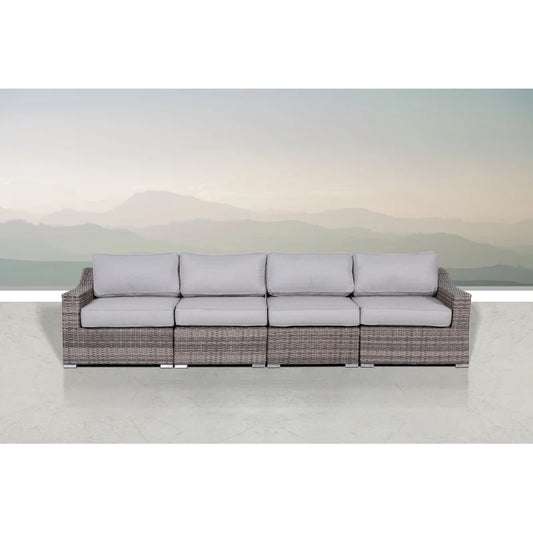 Gray wicker outdoor sectional sofa with plush light gray cushions