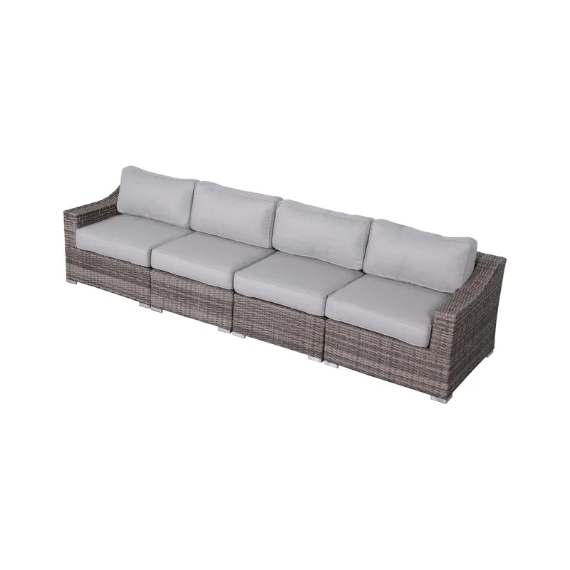 Gray wicker sectional outdoor sofa with plush light gray cushions