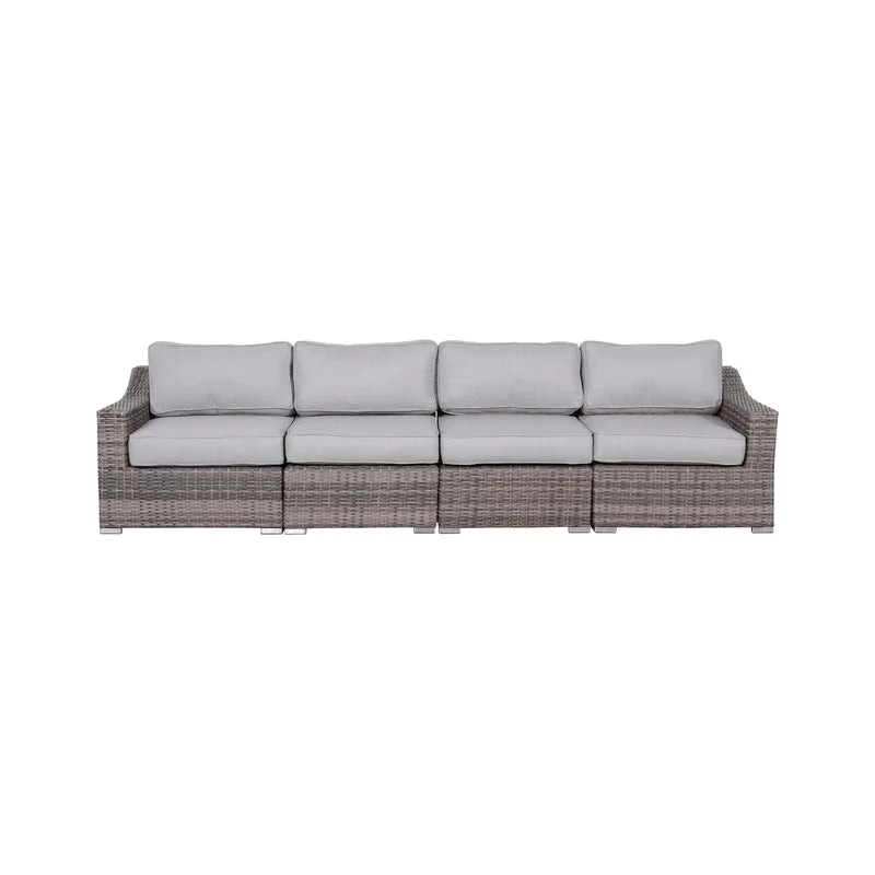 Gray wicker modular sofa with plush light gray cushions for outdoor patio