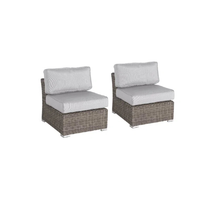 Two grey wicker armless chairs with light grey cushions