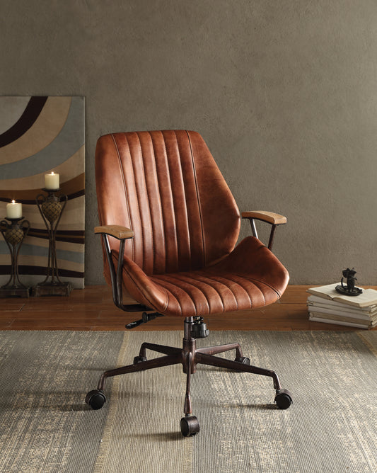 Brown distressed leather executive office chair with vertical channel tufting and wooden armrests