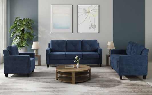 Deep blue upholstered sofa with tufted cushions and track arms