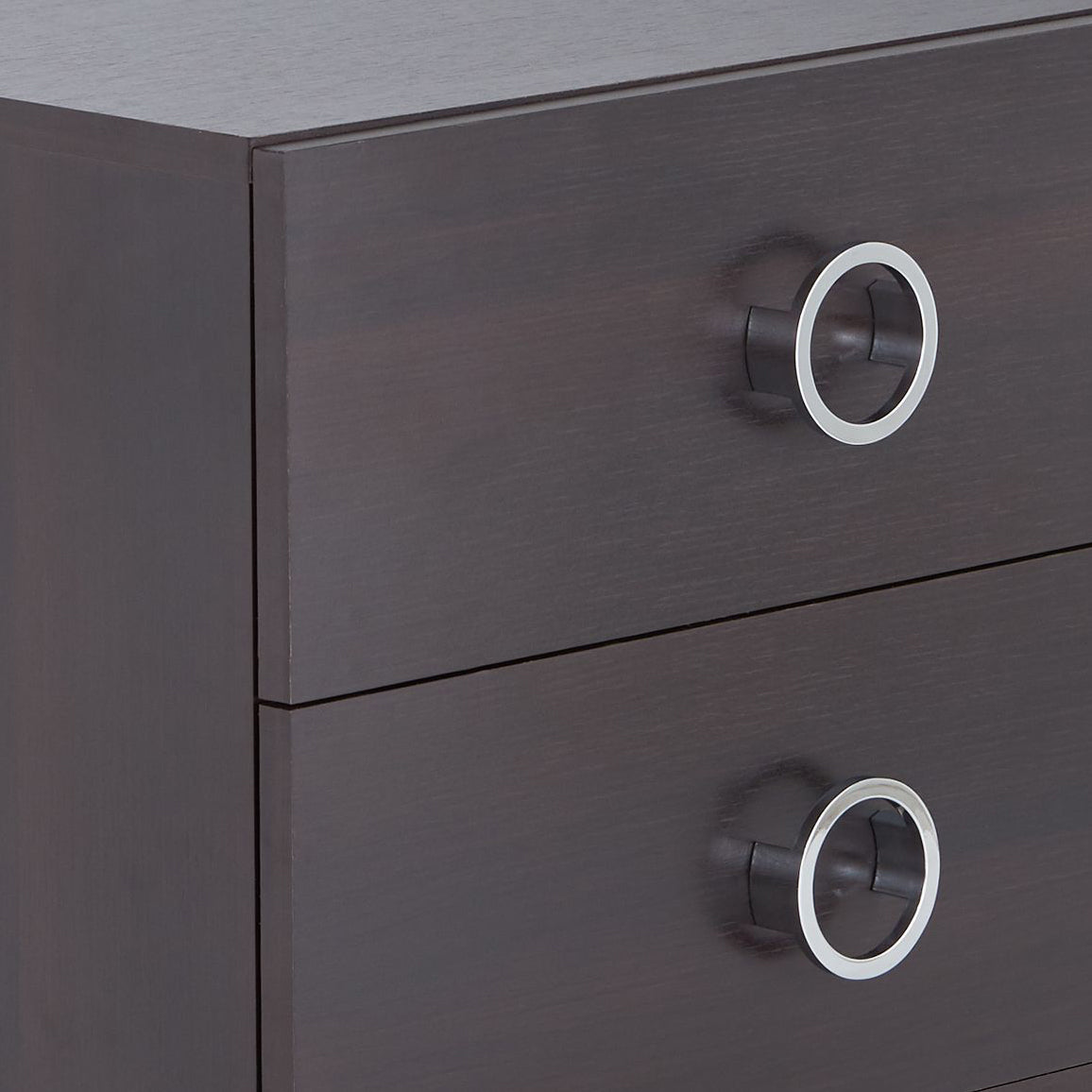 Dark wood dresser with brushed nickel ring pulls