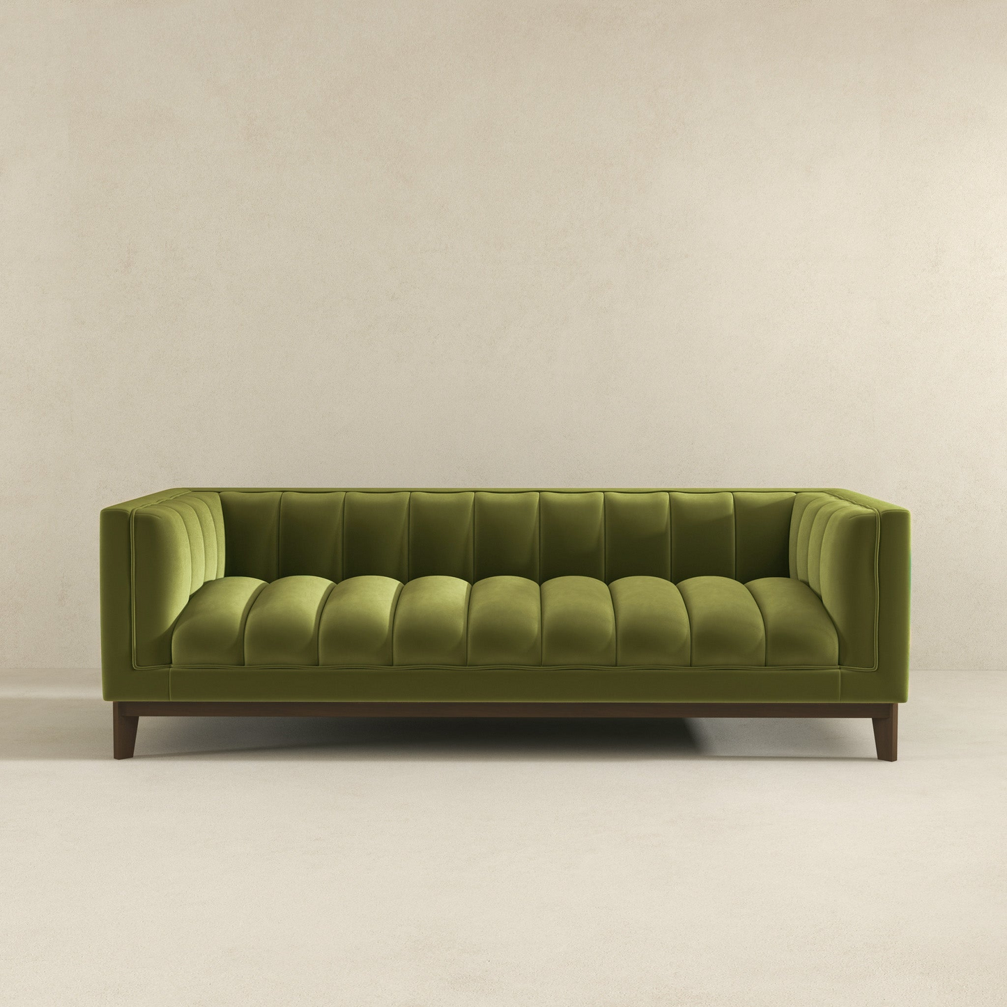 Green velvet channeltufted sofa with dark wood legs