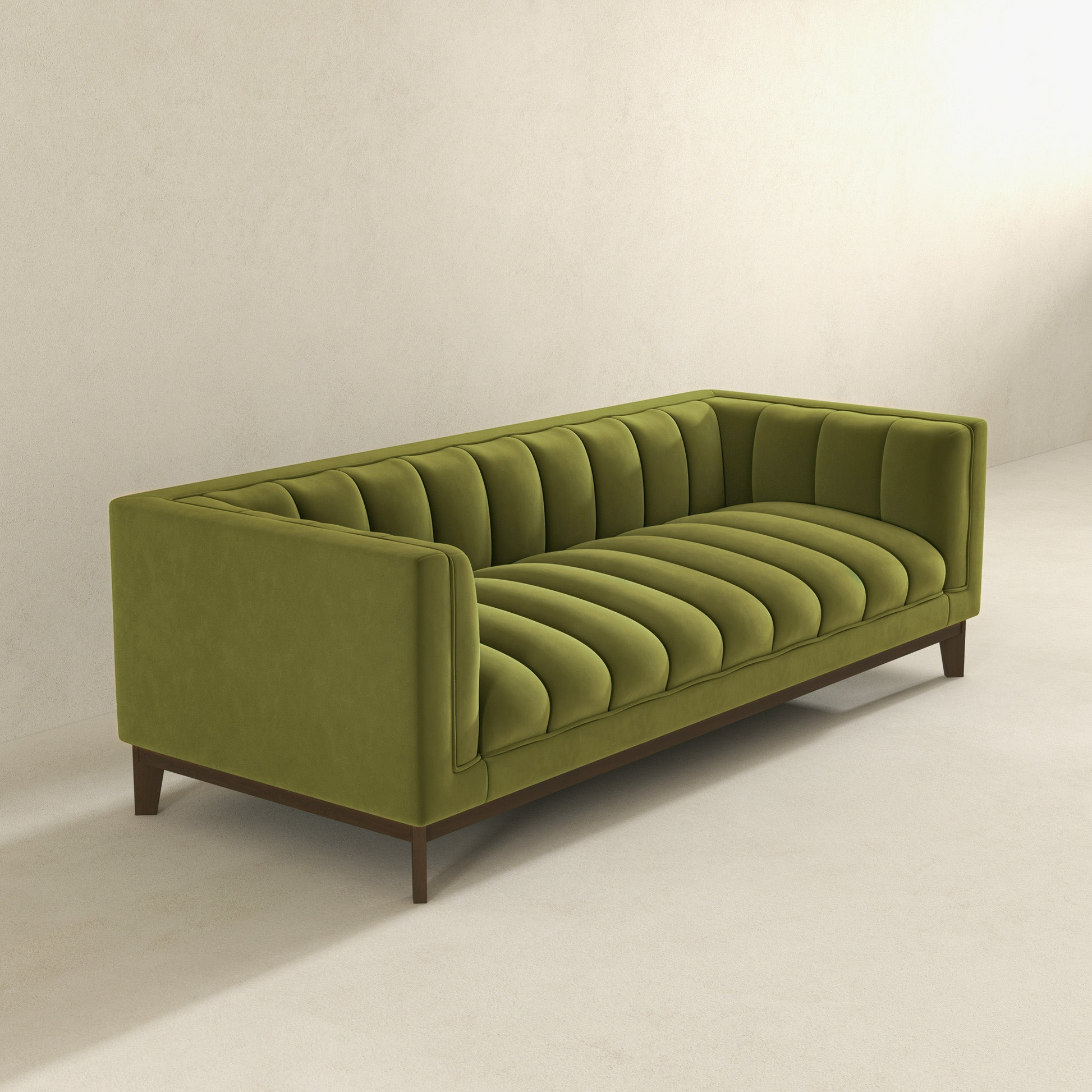Green velvet channel tufted sofa with dark wood legs