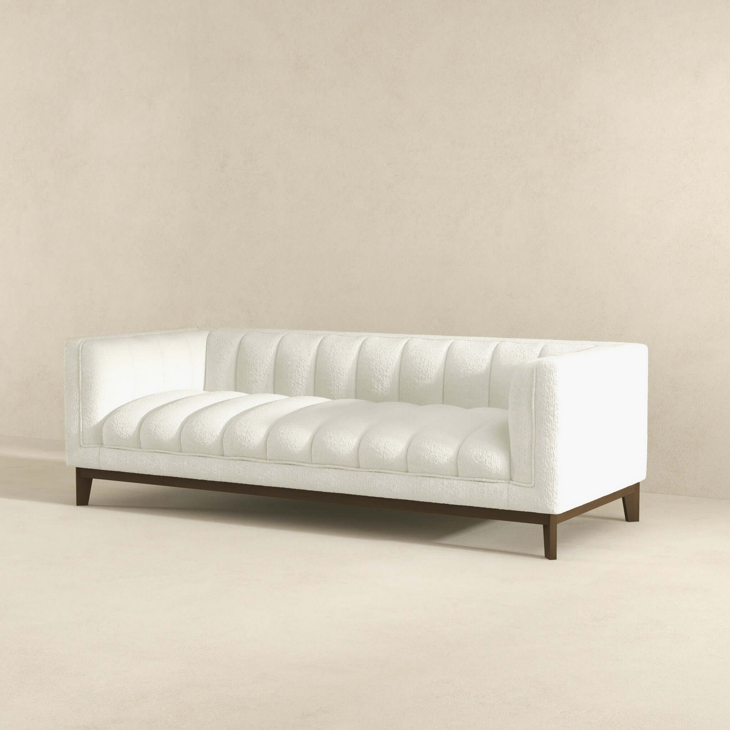 White boucle tufted sofa with dark wood legs