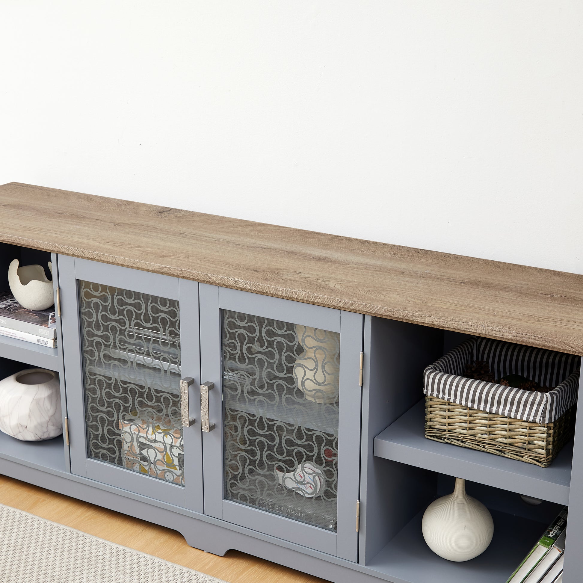 Gray media console with glass doors and wood top
