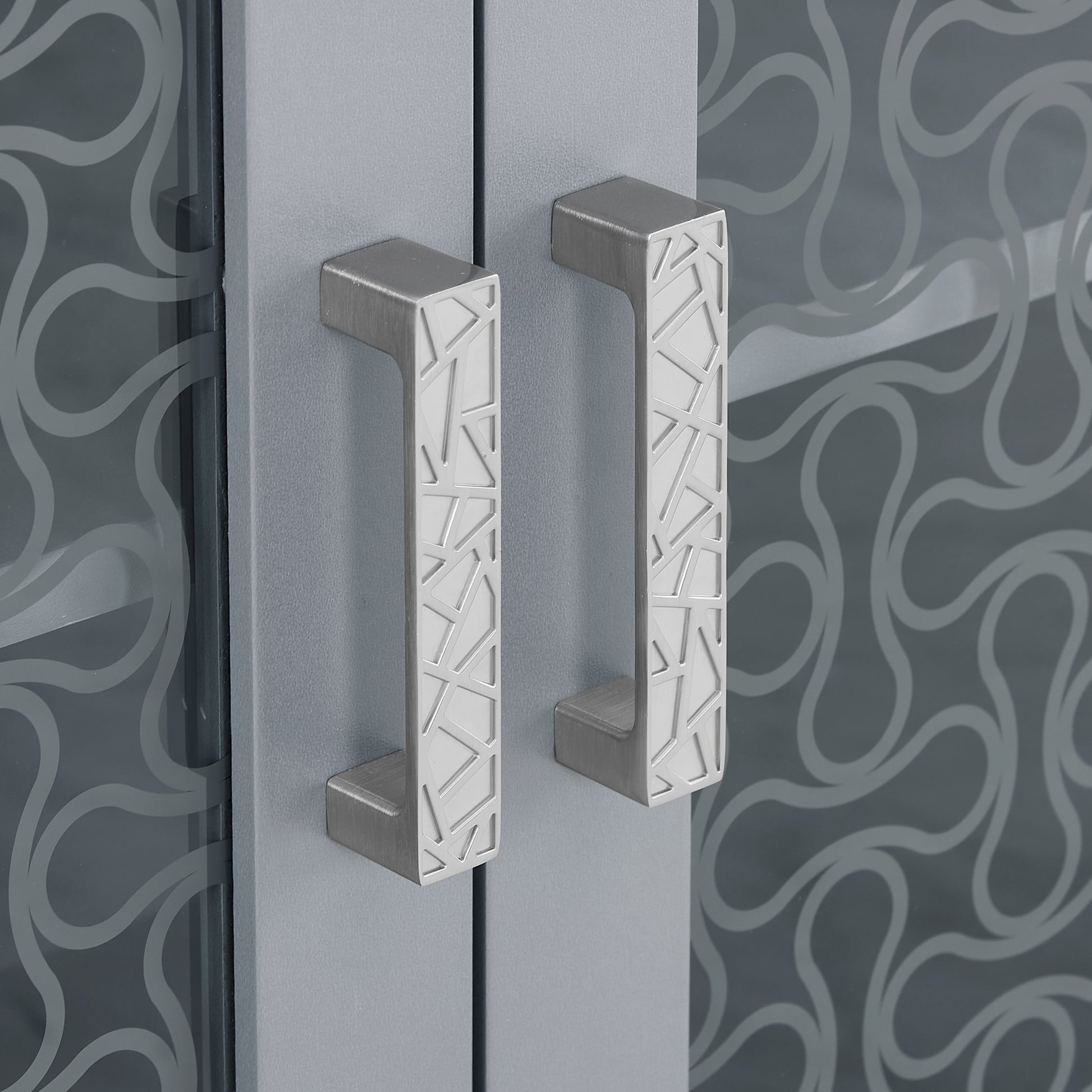 Brushed nickel cabinet handles with geometric cutouts
