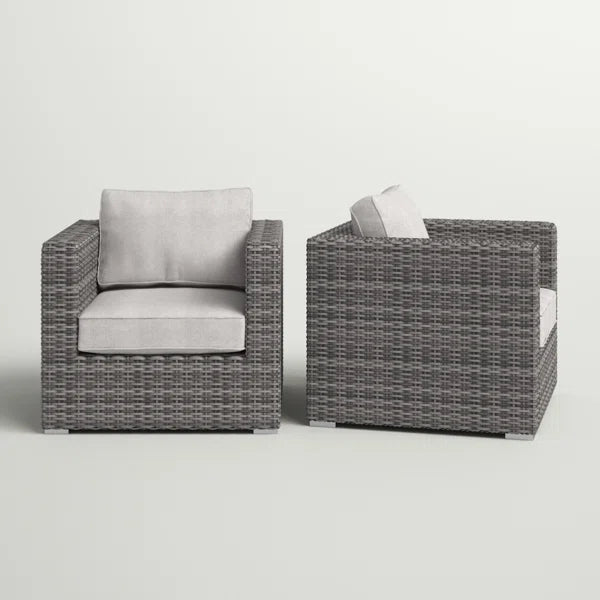 Gray wicker patio chairs with plush light gray cushions