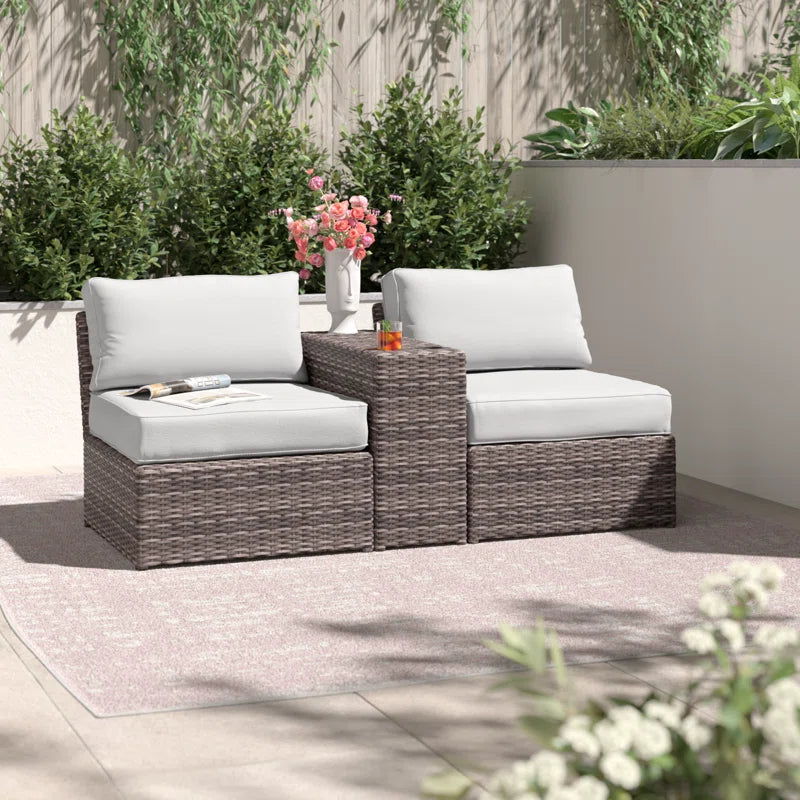 Brown wicker sectional outdoor sofa with white cushions