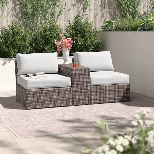 Brown wicker sectional outdoor sofa with white cushions