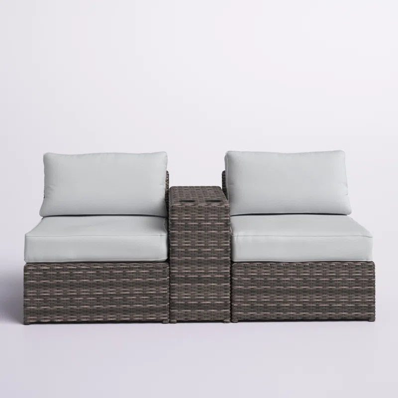 Grey wicker outdoor sectional sofa with light blue cushions