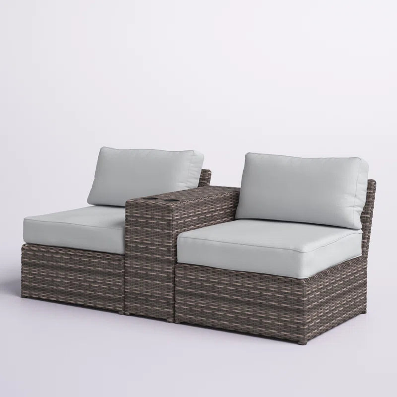 Gray wicker outdoor sectional sofa with light blue cushions