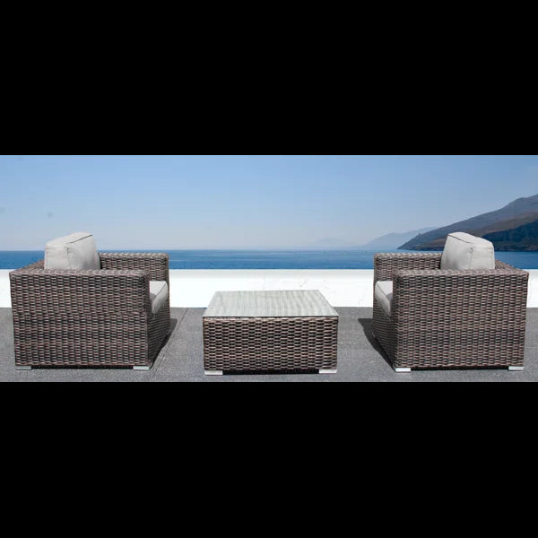 Brown wicker armchair with light grey cushion