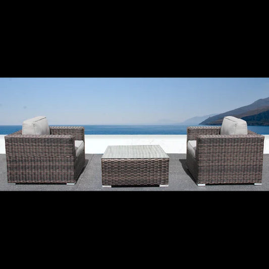 Brown wicker armchair with light grey cushion