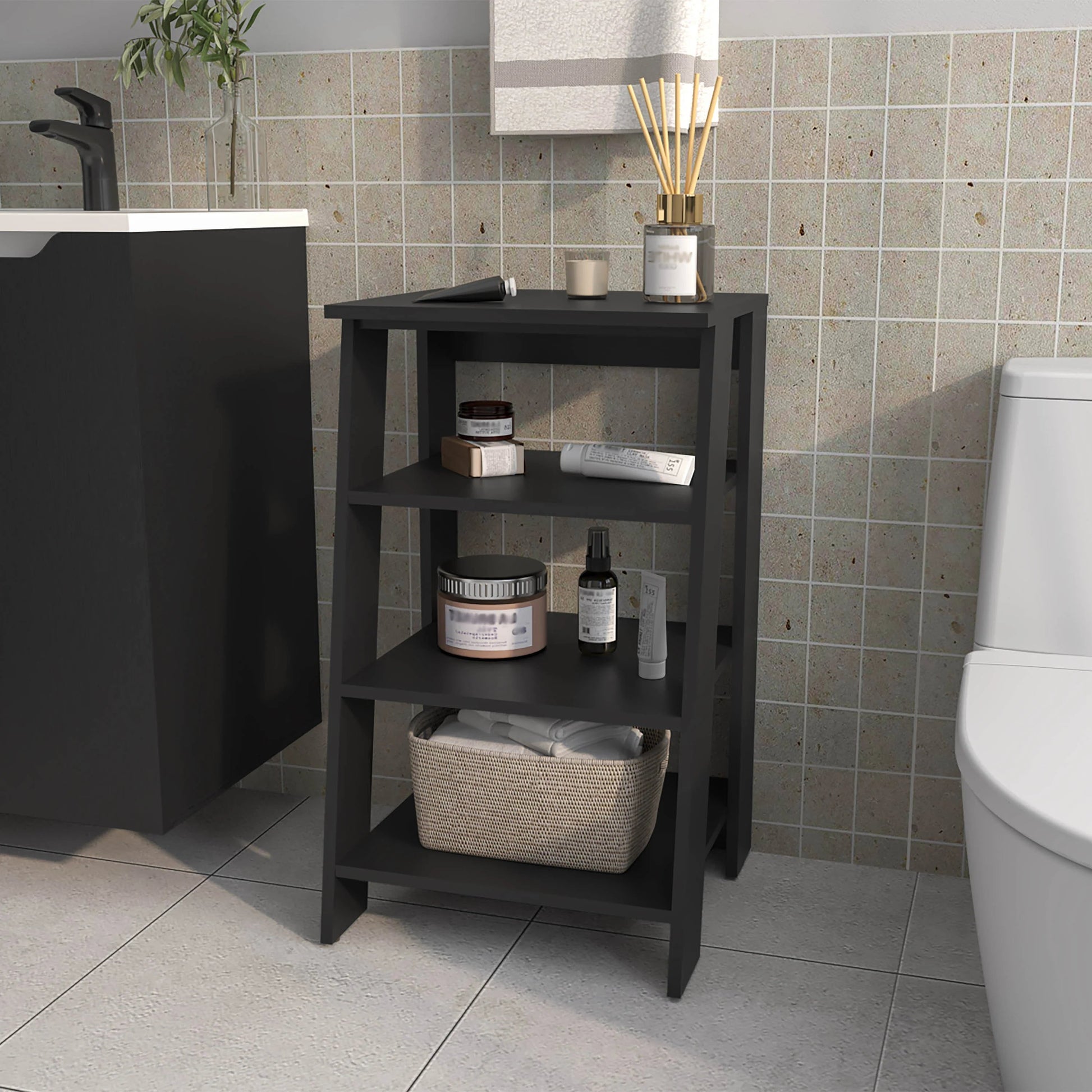 Dark gray tiered bathroom shelf unit holding toiletries and a woven basket