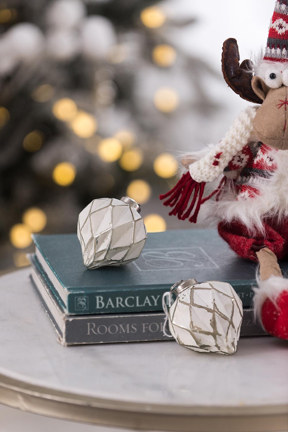 White faceted geometric Christmas ornament with silver accents
