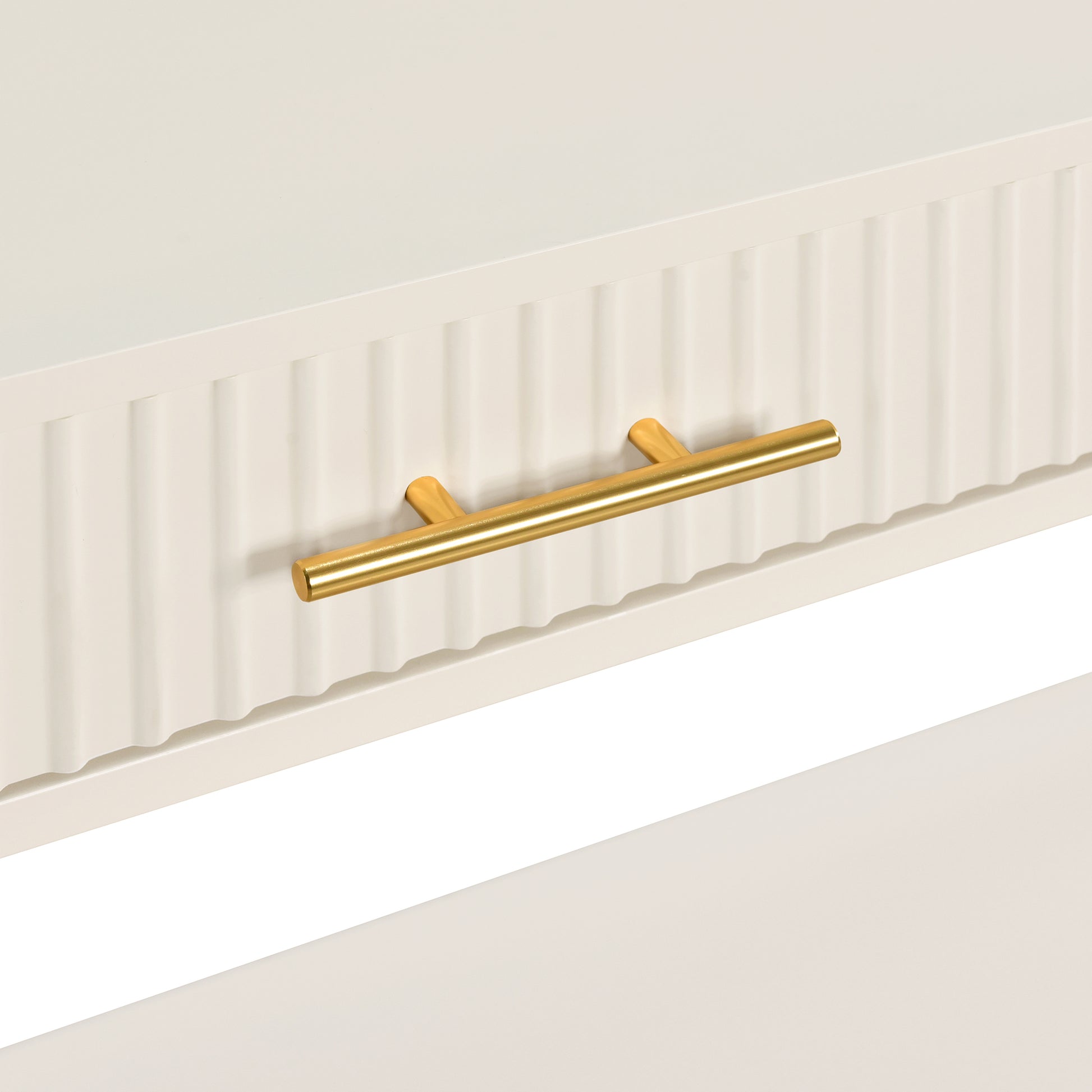 Cream textured drawer with polished brass bar pull