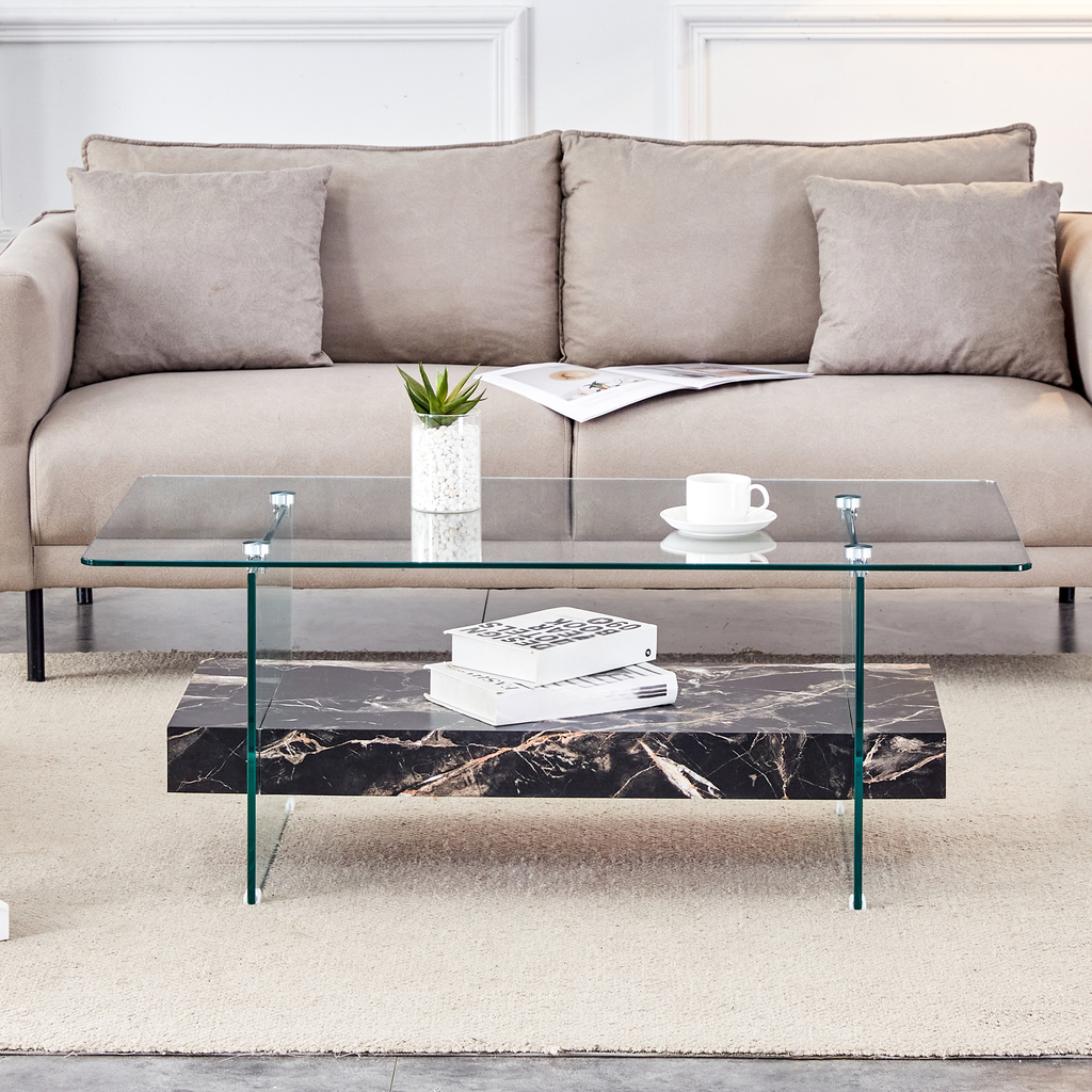 Modern clear glass coffee table with black marble shelf and minimalist design
