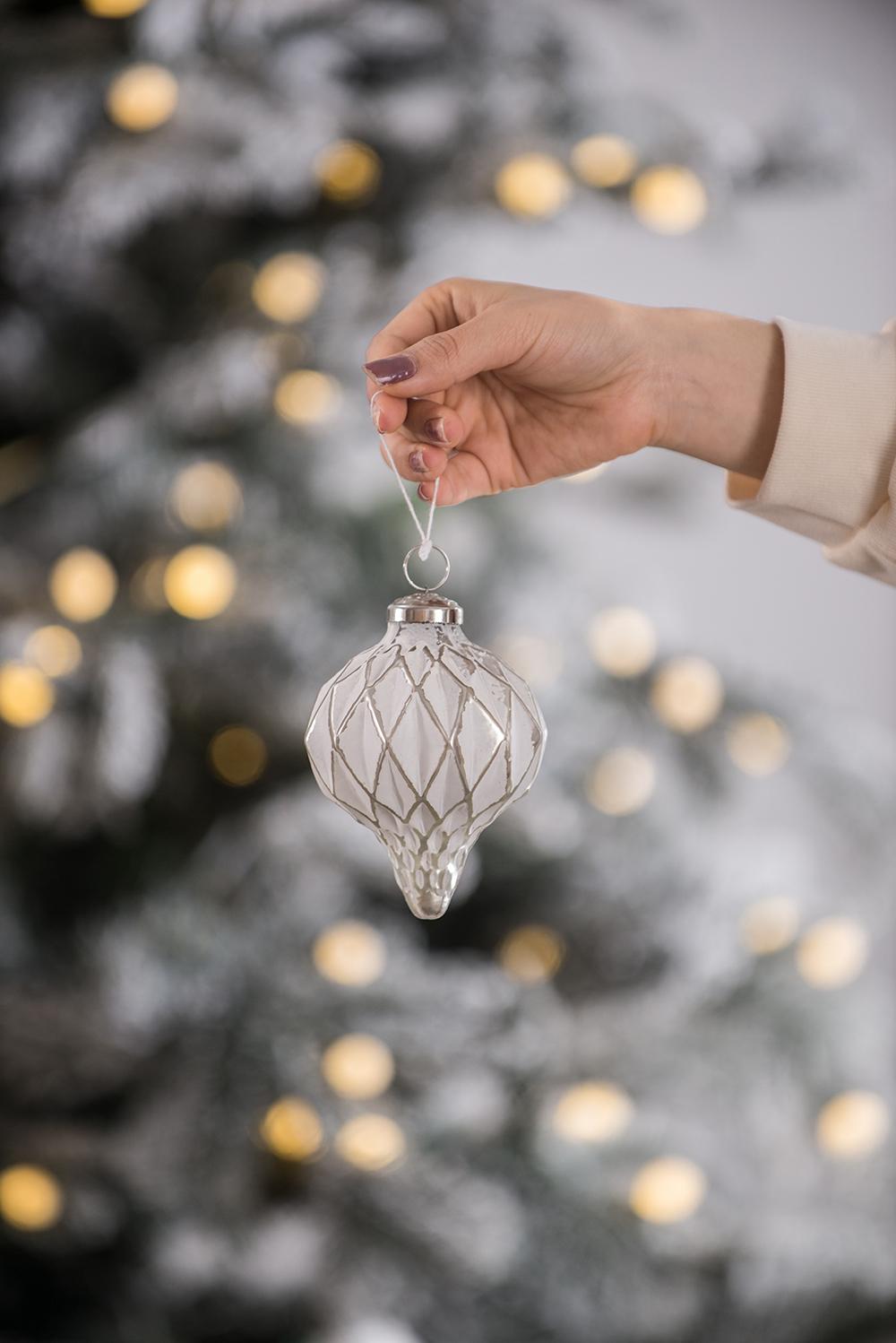 Clear glass teardrop ornament with white etched diamond pattern