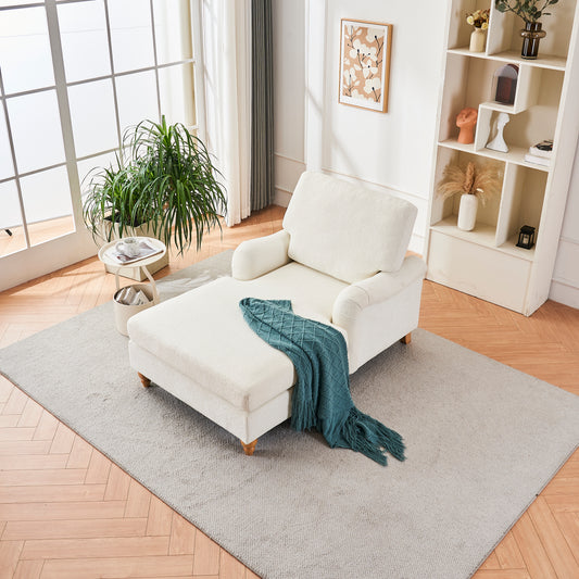 Cream boucle chaise lounge with dark teal throw blanket