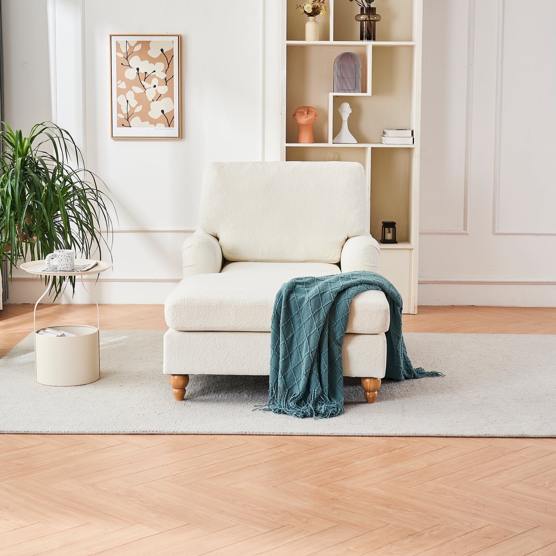 Cream boucle chaise lounge with teal throw