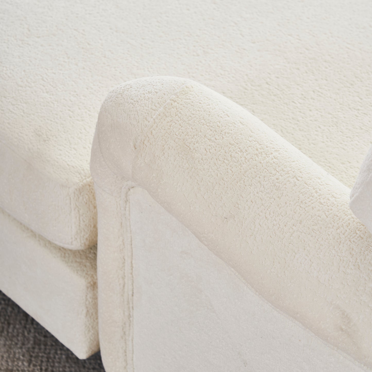 Cream boucle sofa armrest texture