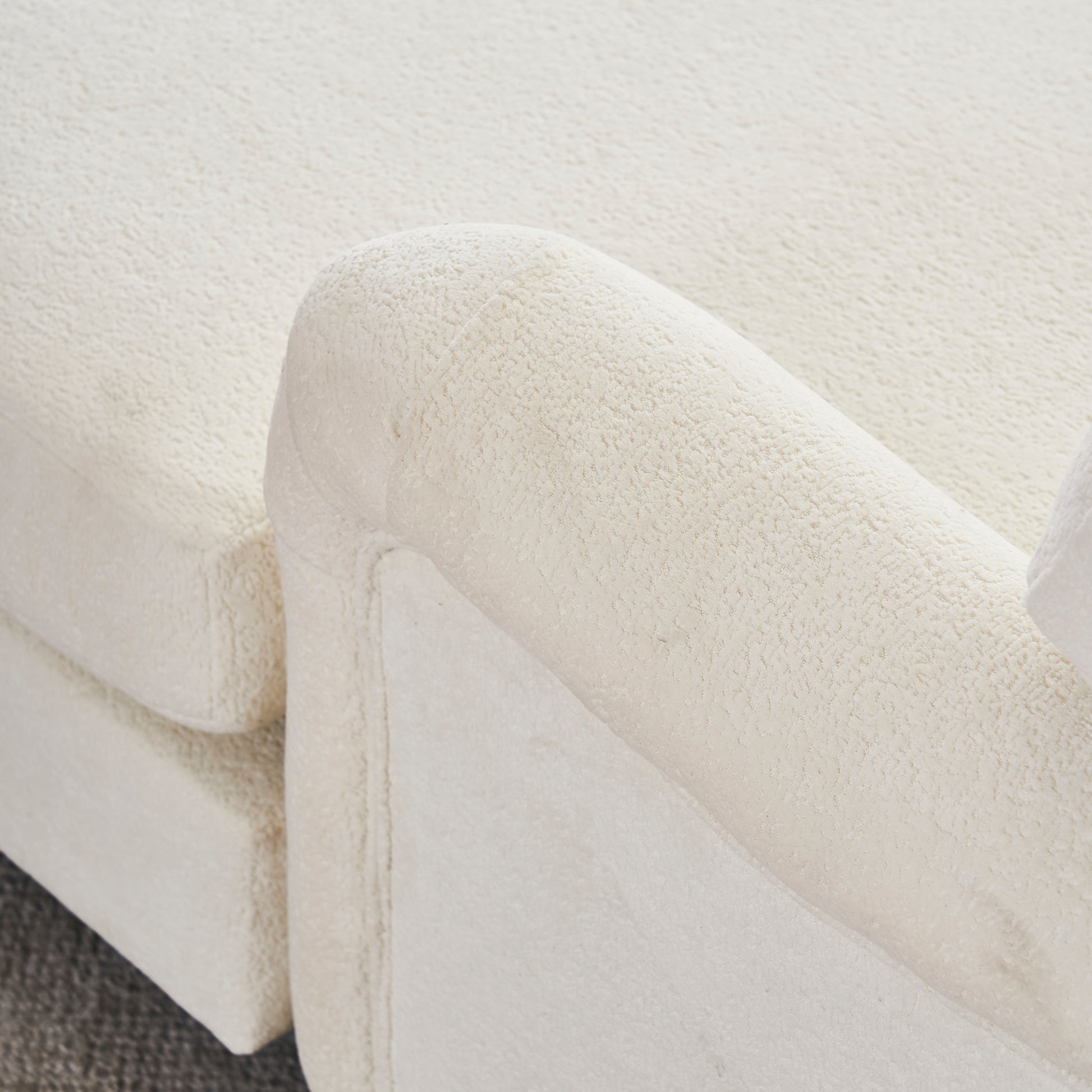 Cream boucle sofa armrest texture