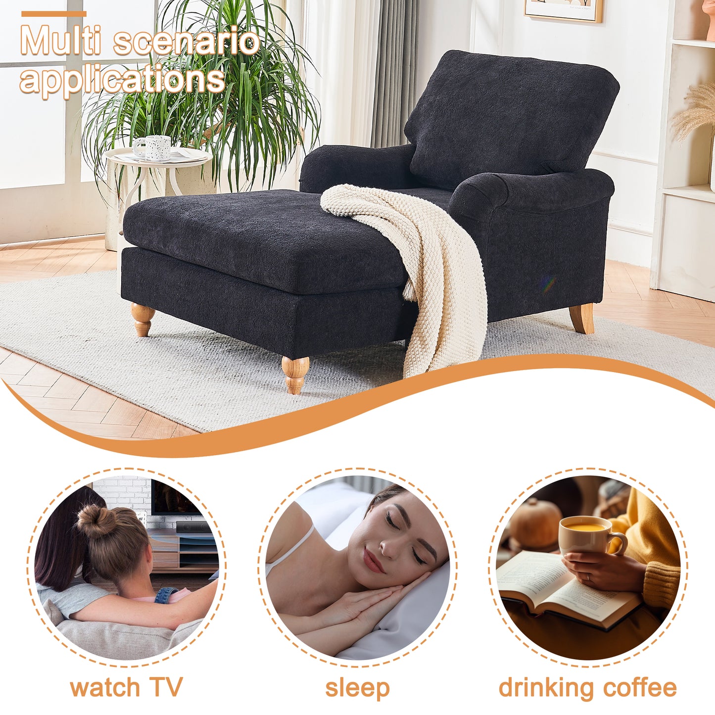 Dark gray chaise lounge with wooden legs and cream blanket