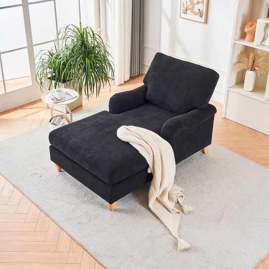 Black fabric chaise lounge with cream throw